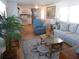 Living room with hardwood floors, comfy furniture, and large artwork at 516 Ashwood Dr, Venice, FL 34285