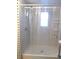 Large walk-in shower with clear curtain at 516 Ashwood Dr, Venice, FL 34285
