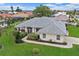 Single-story home with a tile roof and well-manicured lawn at 538 Laurel Cherry Ln, Venice, FL 34293