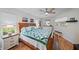 Cozy bedroom with wood floors and a wooden bed frame at 538 Laurel Cherry Ln, Venice, FL 34293