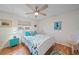 Cozy guest bedroom with a queen-size bed and light decor at 538 Laurel Cherry Ln, Venice, FL 34293