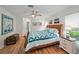 Spacious primary bedroom with king-size bed and en-suite bathroom at 538 Laurel Cherry Ln, Venice, FL 34293