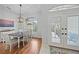 Bright dining room with hardwood floors and a view to the backyard at 538 Laurel Cherry Ln, Venice, FL 34293