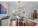 Charming dining room featuring a wooden table and hardwood floors at 538 Laurel Cherry Ln, Venice, FL 34293