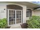 Front entry with a screened porch and a sitting area at 538 Laurel Cherry Ln, Venice, FL 34293
