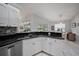 Updated kitchen with stainless steel appliances and granite countertops at 538 Laurel Cherry Ln, Venice, FL 34293