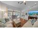 Spacious living room with hardwood floors, sofas, and pool view at 538 Laurel Cherry Ln, Venice, FL 34293