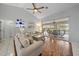 Bright living room with hardwood floors and access to the patio at 538 Laurel Cherry Ln, Venice, FL 34293