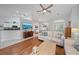 Relaxing living room featuring hardwood floors and ample natural light at 538 Laurel Cherry Ln, Venice, FL 34293