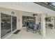 Covered patio with seating area, perfect for outdoor dining at 538 Laurel Cherry Ln, Venice, FL 34293