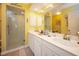 Spa-like bathroom with double sinks and a large shower at 5800 Sabal Trace Dr # 701, North Port, FL 34287