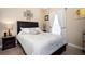 Cozy bedroom with a queen-size bed and nightstand at 5800 Sabal Trace Dr # 701, North Port, FL 34287