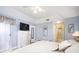 Bright bedroom with king bed and access to a bathroom at 5800 Sabal Trace Dr # 701, North Port, FL 34287