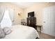 Comfortable bedroom with a dresser and a flat-screen TV at 5800 Sabal Trace Dr # 701, North Port, FL 34287