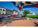 Outdoor seating area with shade structure near shops and restaurants at 5800 Sabal Trace Dr # 701, North Port, FL 34287