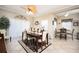 Bright dining room featuring a table with seating for six at 5800 Sabal Trace Dr # 701, North Port, FL 34287