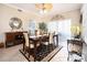Spacious dining area with a table and chairs, and access to patio at 5800 Sabal Trace Dr # 701, North Port, FL 34287