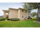 Building exterior with manicured landscaping and walkway at 5800 Sabal Trace Dr # 701, North Port, FL 34287