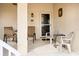 Inviting front porch with seating for two, perfect for relaxing at 5800 Sabal Trace Dr # 701, North Port, FL 34287