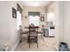 Eat-in kitchen with breakfast nook and view to living area at 5800 Sabal Trace Dr # 701, North Port, FL 34287