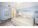 Spacious main bedroom with a king-size bed and ensuite bathroom at 5800 Sabal Trace Dr # 701, North Port, FL 34287