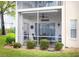 Screened patio with table and chairs, great for relaxing at 5800 Sabal Trace Dr # 701, North Port, FL 34287