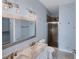 Bathroom with double vanity, shower, and updated fixtures at 640 Back Nine Dr, Venice, FL 34285