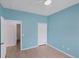 Spacious bedroom with light blue walls and ceiling fan at 640 Back Nine Dr, Venice, FL 34285