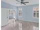 Bright bedroom with tile floors and two windows at 640 Back Nine Dr, Venice, FL 34285