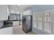 Modern kitchen with white cabinets and stainless steel appliances at 640 Back Nine Dr, Venice, FL 34285