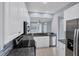 Modern kitchen with stainless steel appliances and granite counters at 640 Back Nine Dr, Venice, FL 34285