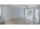 Light blue living room with tile floors and ceiling fan at 640 Back Nine Dr, Venice, FL 34285