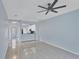 Bright living room with tile floors and ceiling fan at 640 Back Nine Dr, Venice, FL 34285