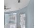 Light blue living room with tile floors and ceiling fan at 640 Back Nine Dr, Venice, FL 34285