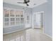 Bright sunroom with white shutters and tile floor at 640 Back Nine Dr, Venice, FL 34285