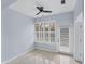 Bright sunroom with white shutters and tile floor at 640 Back Nine Dr, Venice, FL 34285