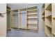 Large walk in closet with shelves and hanging rods at 640 Back Nine Dr, Venice, FL 34285