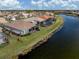 Lakefront house with screened-in patio and lush backyard at 651 Lakescene Dr, Venice, FL 34293