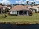 Aerial view of home with backyard and lake access at 651 Lakescene Dr, Venice, FL 34293