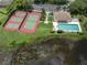 Community pool, tennis courts, and parking at 651 Lakescene Dr, Venice, FL 34293