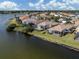 Lakefront house with screened-in pool and patio area at 651 Lakescene Dr, Venice, FL 34293