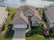 Aerial view of single-Gathering home with tile roof at 651 Lakescene Dr, Venice, FL 34293