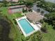 Community pool, tennis courts, and parking at 651 Lakescene Dr, Venice, FL 34293