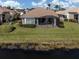 House with screened-in patio overlooking a tranquil lake at 651 Lakescene Dr, Venice, FL 34293