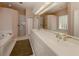 Bathroom features double vanity, soaking tub, and walk-in shower at 651 Lakescene Dr, Venice, FL 34293