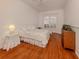 Bedroom with hardwood floors and wood trim at 651 Lakescene Dr, Venice, FL 34293