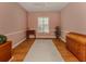 Relaxing bedroom with hardwood floors and ample natural light at 651 Lakescene Dr, Venice, FL 34293