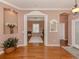 Elegant entryway with hardwood floors and views to other rooms at 651 Lakescene Dr, Venice, FL 34293