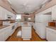 Well-equipped kitchen with ample cabinetry and hardwood floors at 651 Lakescene Dr, Venice, FL 34293