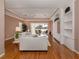 Bright living room with built-in shelving and hardwood floors at 651 Lakescene Dr, Venice, FL 34293